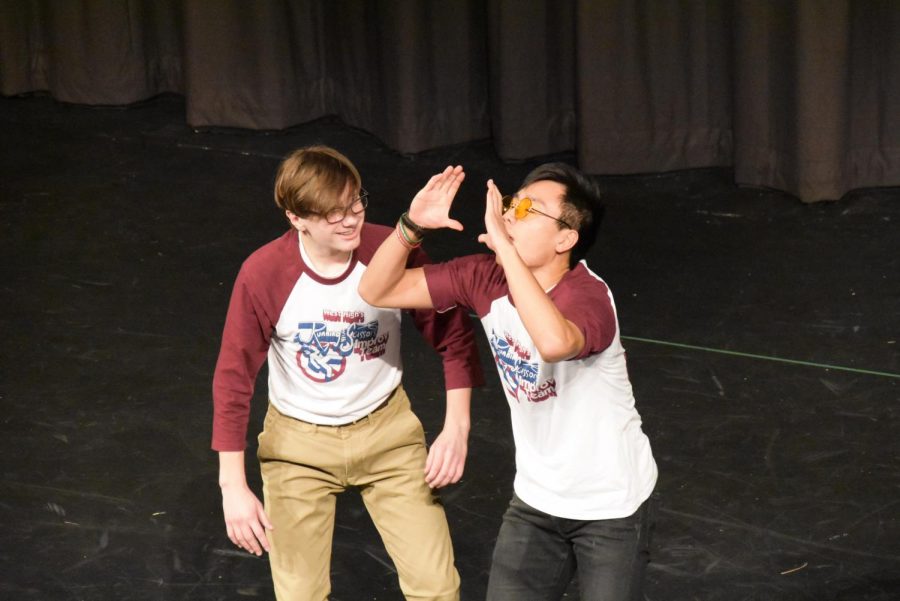 Bathed in spotlights, senior Jon Ma and freshman Brian Isele entertain the audience at the improv show Friday, Oct. 25.