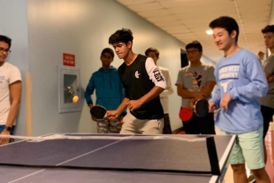 Eyes focused on the ping pong ball, junior Ali-Raza Rizvi serves to his opponents. Before the first official meeting of Table Tennis Club, Rizvi met up with club co-founder and junior Skyler Ji to play for fun. “Ping pong is a sport of precision and accuracy; I thought this describes me perfectly,” Rizvi said. “This club provides a fun environment where everyone can enjoy playing competitively and recreationally.”