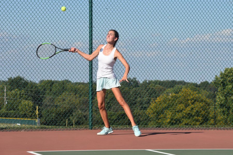 Rallying for the point, junior Lindsey Anstrom plays during girls tennis senior night Oct. 1. Both JV and varsity defeated Eureka while honoring their seniors. “The season went by really quickly. This was the best season for me because I had my best friend, Gabrielle Oliver, as my partner, and we would just have fun on the court,” Anstrom said. “We would worry about the score, but we wouldn’t stress if we were losing. We did this handshake after each play, no matter if we won or lost the point; it was just a sign of sportsmanship and that we trusted each other.”  