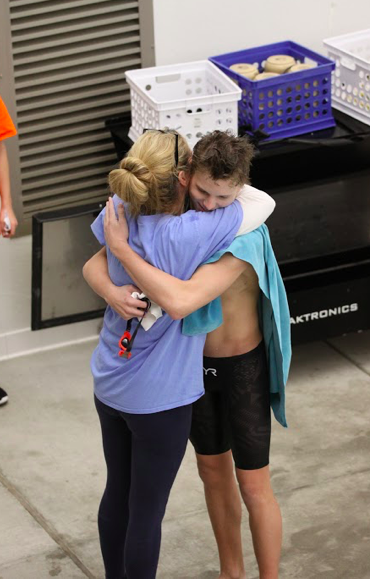 Bonnett embraces assistant coach Mary Beth Wilson during the Conference Championship swim meet at Pattonville High School on Nov 6. Bonnett’s hard work throughout the season resulted in Conference first place swims in the 200 IM, 500 Freestyle and 400 Freestyle relay. 