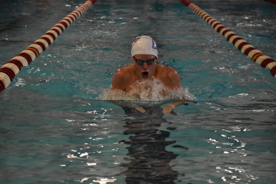 Sophomore Will Bonnett finishes a lap of breastroke during a home meet versus Parkway Central. Bonnett focused on gaining strength outside of the pool to aide his transition back into the water after healing. “I feel like I was able to build more muscular strength while out of the pool, and I was able to put in a lot of endurance work in the water to help get me back to my past endurance level,” said Bonnett. “Both of these things combined together to help me perform better than I ever have.” 
