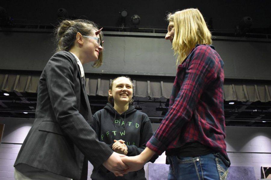 Listening to junior and unofficial marriage officiant Gillian Davis, senior Seaira Knight and junior Lana Hughes practice for their “wedding.” Having met in middle school, Knight and Hughes developed a close, platonic relationship that became mistaken as romantic over the years. “Everyone thinks we’re dating, so it became a joke. [On] Valentine’s Day, it became a fake proposal. That’s how the whole ‘marriage joke’ started,” Hughes said.