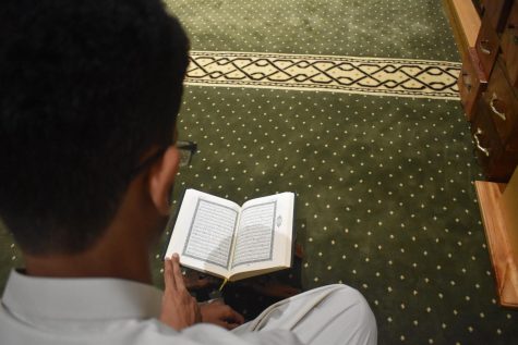 Sophomore Waleed Abdulla reads passages of the Qur’an before prayer.