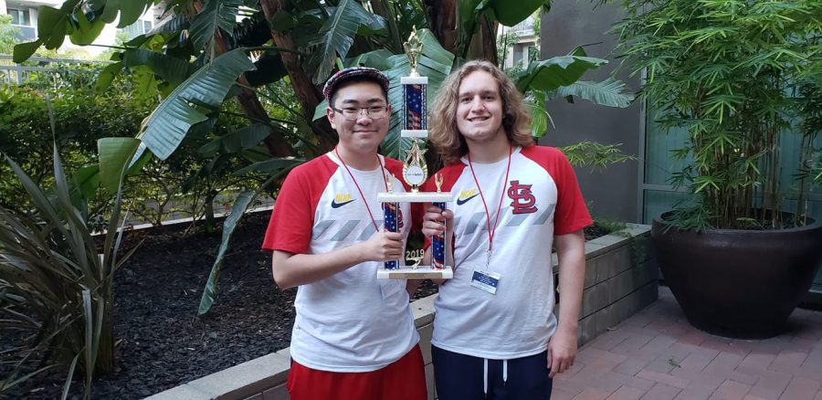 After+winning+their+competition%2C+seniors+Jason+Yang+and+Ben+Goff+stand+outside+the+venue%2C+holding+their+trophy.+The+competition+lasted+for+three+days+from+Sept.+13+to+Sept.+15.+%E2%80%9CThis+was+an+amazing+experience%2C+and+I+am+glad+we+were+able+to+compete%2C%E2%80%9D+Goff+said.+%E2%80%9CI+just+like+being+able+to+come+up+with+unique+ideas+and+being+able+to+design+a+robot+and+put+them+to+test+and+see+which+ideas+worked+and+which+ones+didn%E2%80%99t.%E2%80%9D