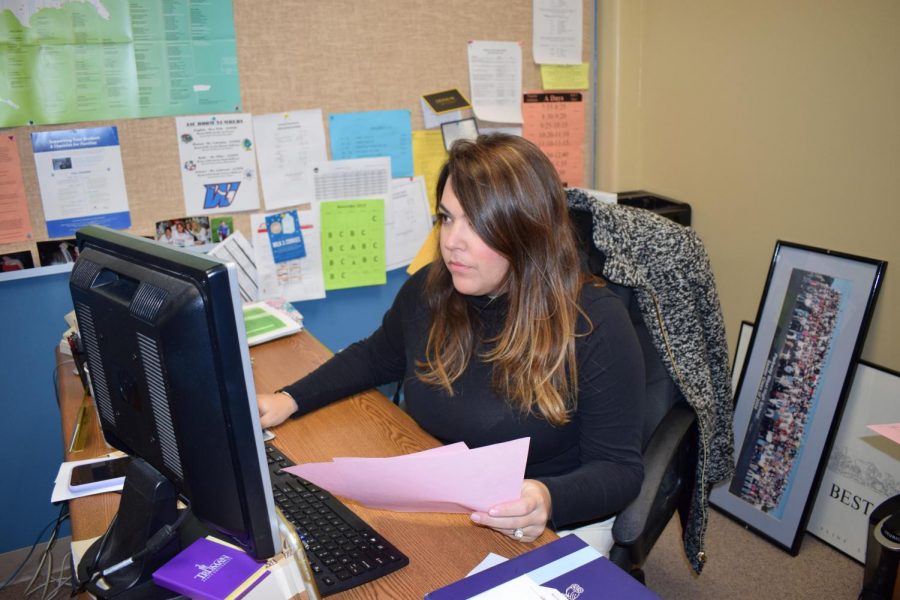 College and career secretary Lauren Rowe finishes submitting a senior’s college admission paperwork. Rowe began submitting Transcription and Information Release Requests immediately upon her arrival at school. “As I reached the office I already had pink sheets in my box,” Rowe said. “I submitted the materials right away so everything reaches the offices of admissions in a timely manner.” 