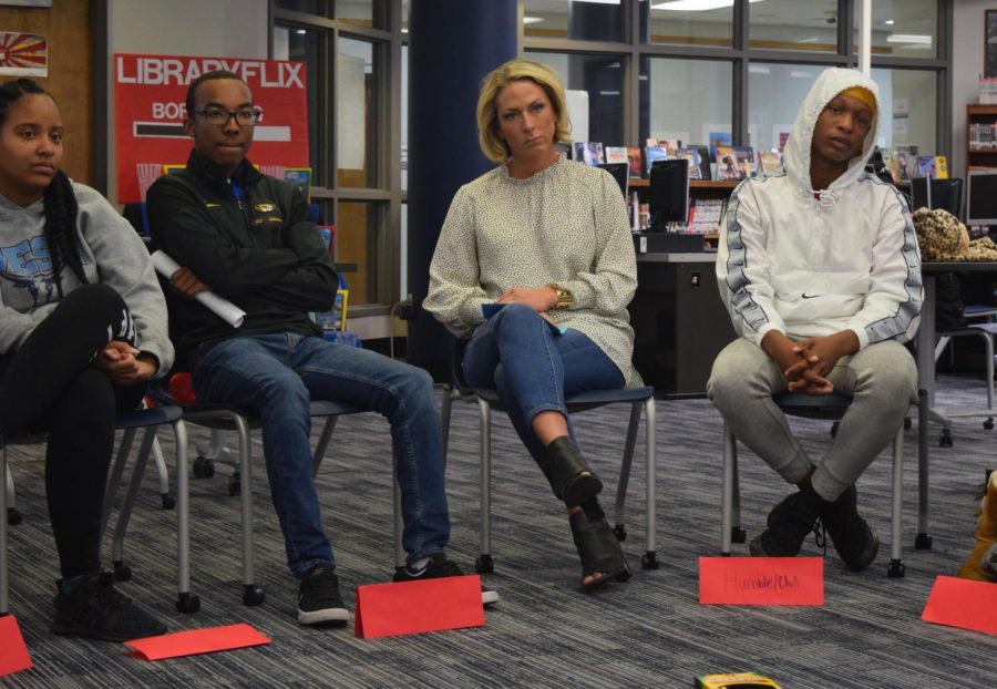 Junior Tiye’ Hyler, senior TJ Fleming, guidance counselor Jen Skalski and freshman Brian Campbell sit and listen to students talk during a restorative circle. In the library, African American students discuss with teachers and others about what it is like to be a black student at a predominantly white school. “It can be tricky because you don’t want to offend anyone, you want everyone to understand that you come with a good heart and your goal is to help them succeed,” Perez said.  
