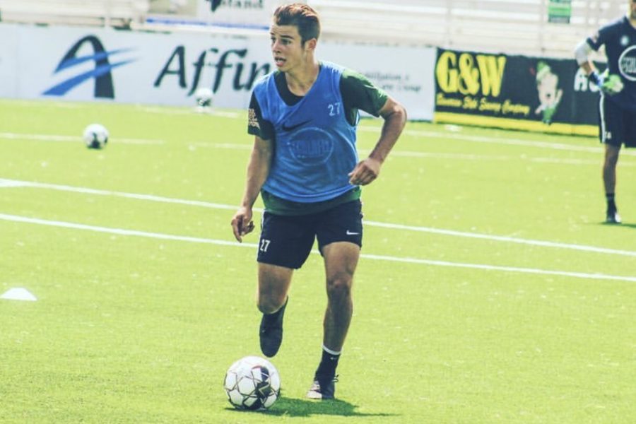 Senior Jansen Miller dribbles the ball up the field during practice with St. Louis Football Club  (STLFC). Miller recently made his commitment to Xavier University. “It was the family culture there,” Miller said. “Most schools, you’ll hear them say ‘oh we have a family culture’ but you could really feel it with Xavier.”
