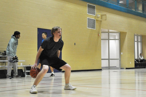 Dribbling behind the back, sophomore Sawyer Reidt sets up an open jump shot. In October, Reidt and a few friends had the idea to create a J League basketball team. “We were just looking for a way to hang out more at first,” Reidt said. “It turned into us making a whole team once the Mag1c Stairs first started. I’ve had so much fun with it, and I hope it becomes a tradition with our group of friends.”