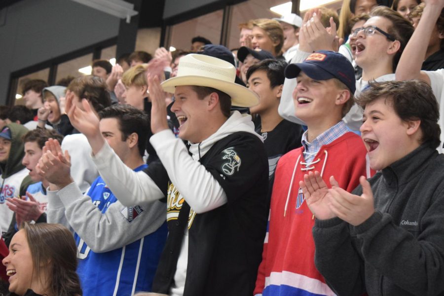 Seniors Tommy Mohan, Tyler Purdum, Garrett Larsen and Patrick Hill cheer on the hockey team. The team took the win against Parkway South 8-2 at Maryville Hockey Center. “I like the energy of hockey games, its loud and fun, especially when we beat our rivals,” Mohan said.