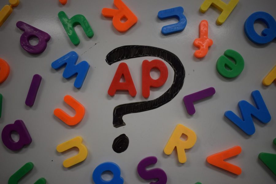 A photo illustration of letters scattered around an A and P.