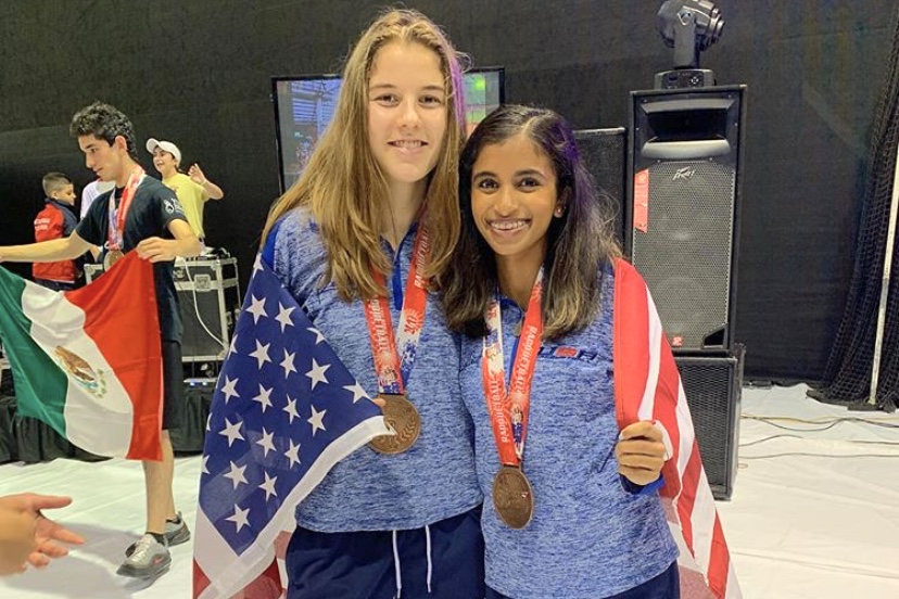 Wrapped in the American flag, senior Erin Slutzky and doubles partner, freshman at University of California, Berkeley, Nikita Chauhan celebrate their performance at the International Racquetball Championships (Worlds). Though this was Slutzky’s second Worlds debut, she won a medal for the first time. “The best thing about getting bronze was the improvement it showed from the year before at Worlds in Mexico where I didn’t get a medal. It meant my hours and hours of training had paid off,” Slutzky said. 