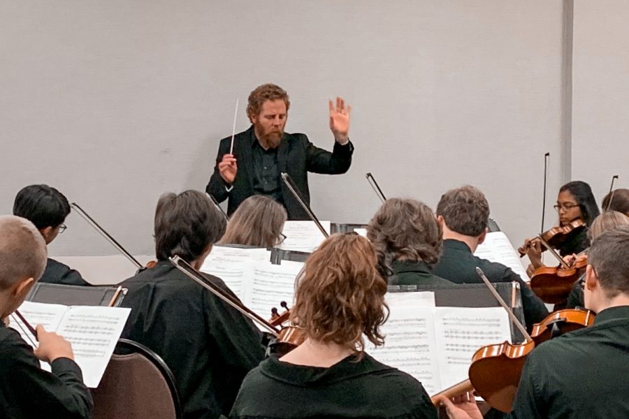 Thirty minutes before the concert at the Missouri Music Educators Association (MMEA) workshop conference, members of Symphonic Orchestra rehearse “Libertango” under the direction of orchestra teacher Ed Sandheinrich Jan. 24. Throughout the three-day workshop, performance groups were given half an hour to tune, warm up and wrap up the final details before their performance. “Everyone was awesome in their playing and their professional behavior. It was hard for me to go from point A to point B at the resort because, well, its a crowded mess, but people kept stopping me to say how much they loved the performance,” Sandheinrich said.