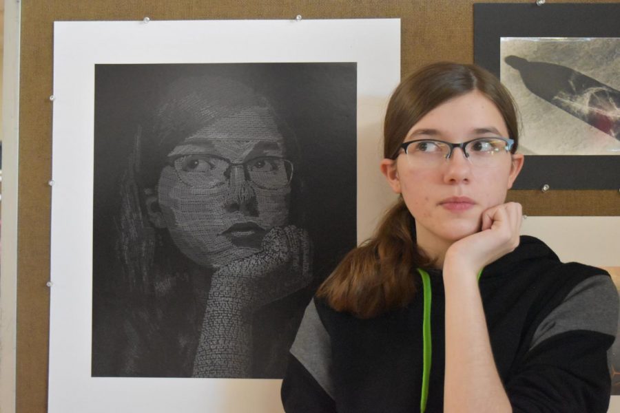 Junior Elizabeth Mosher matches the pose of a self-portrait she created in her Digital Design 2 class. Across her face “Elizabeth” is repeated, and on her arm, neck and hair, the space is filled with song lyrics. “It was face typography, so it’s just a picture of your face using text to fill it up and give it the illusion of life. [I was] expressing who I am through the songs I listen to. I didn’t want to have to repeat random words. It was fun while I was working because I could have the song going through my head and just type out the lyrics as they came to me. I just had more fun with it this way.”