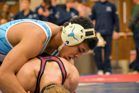 As senior James Griffin pins his opponent, his teammates cheer him on. Griffin has a record of 34-2 this season and has committed to Lindenwood University. “This season, I feel like I’m more on top of my game. I feel like everything is starting to come together and click,” Griffin said. “I’m definitely seeing it in my wrestling, and another thing is that it’s starting to slow down for me. Last year, everything used to be really fast, and it felt like I didn’t have time to think. Now, everything has slowed down for me. I’m understanding patterns a lot better and peoples’ movements, so the biggest thing is that it’s slowed down for me.”