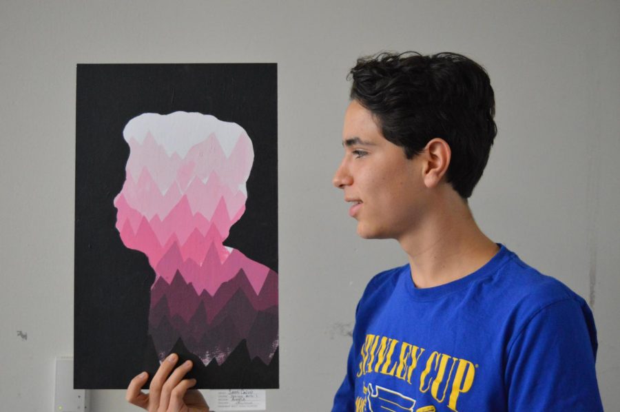 Beside a painting he made in Design Arts I, freshman Santi Calvo mirrors the pose. The project was to take a picture of your profile, cut it out and create a value scale of a pattern designed by each painter. “Making art is fun because I get to use my creativity to do my work and have fun with it. I really enjoyed being able to use different shades and tints of colors on the painting,” Calvo said. “Art to me is a form of expression that words cannot achieve.”