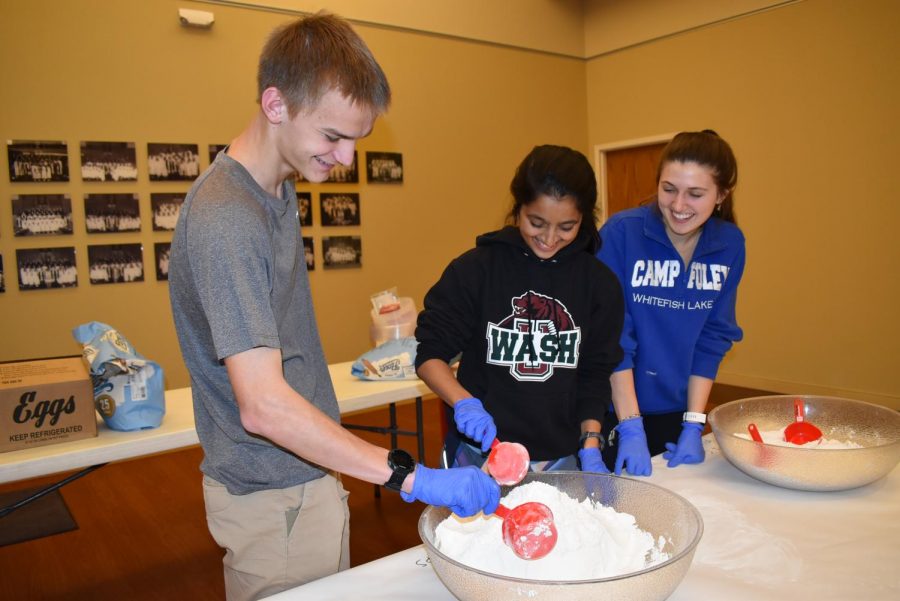 Volunteering at the United Hebrew Congregation Challah Club, seniors Jonah Yates, Anjali Shah and Emma Caplinger dispense flour to participants. Due to coronavirus fears, there was an equal amount of participants as there were volunteers. The most rewarding aspect of the volunteer opp was that I was able to connect not only with West volunteers but the Jewish community and do an activity that Id never done before, Shah said. I enjoy baking, but Ive never made challah bread before, so it was really fun to learn a new skill while also helping other people do the same. Afterwards, I got to bake it at home, and it turned out really well. My family really enjoyed it, and at school some of the volunteers brought their challah in to compare the taste and texture and share it with people who werent there.