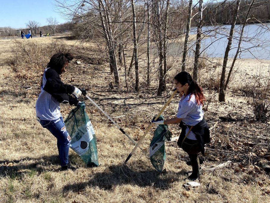 Picking up trash along a stream, sophomores Daniellie McLaurin and Natalie Huff participate in the annual Day of Service by supporting The Stream Cleaning Organization of St. Louis March 5. Students had the opportunity to go out in their communities and volunteer with their common ground classes. “It was such a great opportunity to go out and be able to serve the community. The best part was when we were all picking up trash; it was kind of like a competition,” Huff said. “It was a lot of fun, and I liked that we were able to do a lot of walking and [were able] to enjoy the outdoors.” 
