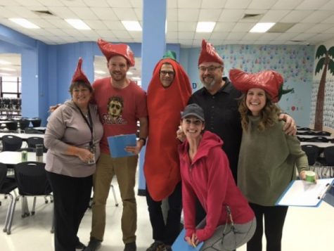 Dr. Corey Sink poses with Building Manager Kitty Strong, English teacher Cassey Holland, former Building Manager Scott Bollman, Librarian Lauren Reusch and FACS teacher Katie Hashley. Sink and the faculty members judge West’s annual Staff Chili Cook-off. Its a fun event we all get to do together. I love funny times like those and just getting to be with the great people here, Sink said. Im going to miss it.