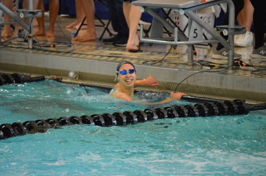 Senior Lauren Beard finishes her last lap at a swim meet. Beard plans to continue swimming at the collegiate level. “It’s such an escape from life’s craziness,” Beard said. “It allows me to take a step back and get out all of the anger and frustration I have built up. The community is so supportive and it’s like a second family.”