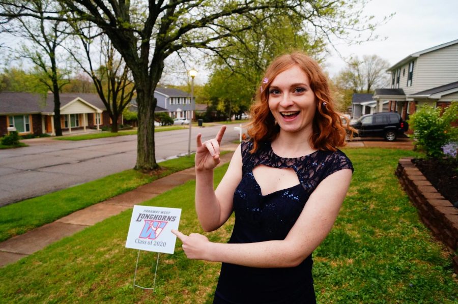 Throwing her horns up, senior Maddie Hoffman has a “Zoom prom” with her friends. Hoffman and her friends dressed up to video chat on Zoom and celebrated prom together by coming up with funny senior superlatives. “My favorite part was getting to spend that time with my sister. It’s the sort of thing we normally would’ve been doing with friends, and we got to do it together. I think celebrating prom in a different way was just what everyone needed at a time like this,” Hoffman said. 