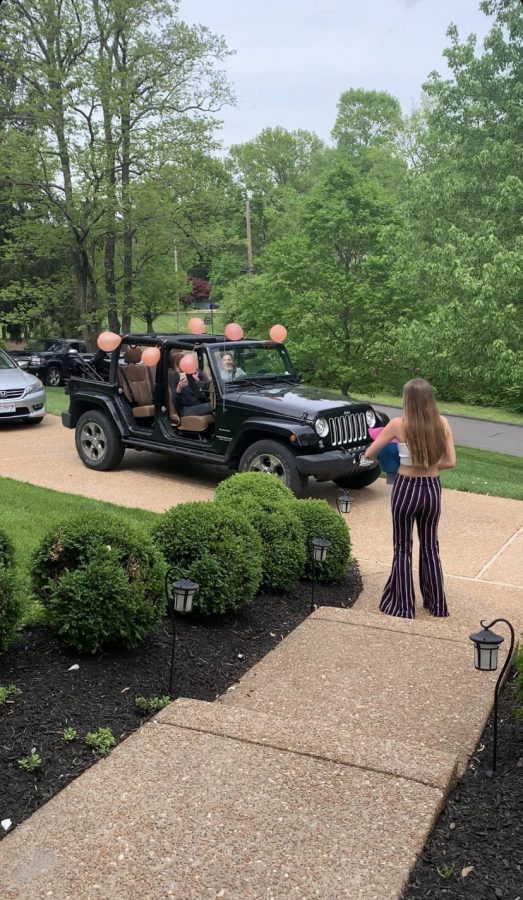 Celebrating her birthday in May, senior Ale Calvo is greeted by her friends with a car parade. 