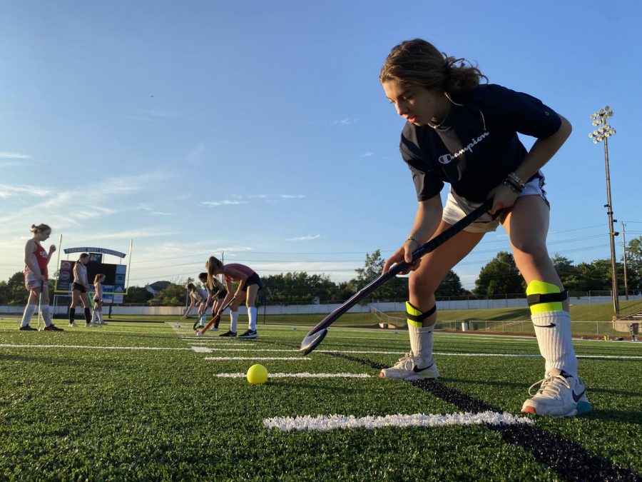 Working on her ball control, sophomore Lexie Lutz practices with her field hockey team while maintaining distance. With COVID-19 regulations impacting every fall sport, field hockey is considered a moderate frequency sport so they must gradually progress into full contact with one another. “I am disappointed because playing field hockey is something I look forward to all year, so its a big letdown to have COVID put restrictions on me and my team because it makes it harder to enjoy,” Lutz said.


