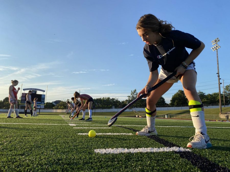 Working on her ball control, sophomore Lexie Lutz practices with her field hockey team while maintaining distance. With COVID-19 regulations impacting every fall sport, field hockey is considered a moderate frequency sport so they must gradually progress into full contact with one another. “I am disappointed because playing field hockey is something I look forward to all year, so it's a big letdown to have COVID put restrictions on me and my team because it makes it harder to enjoy,” Lutz said.


