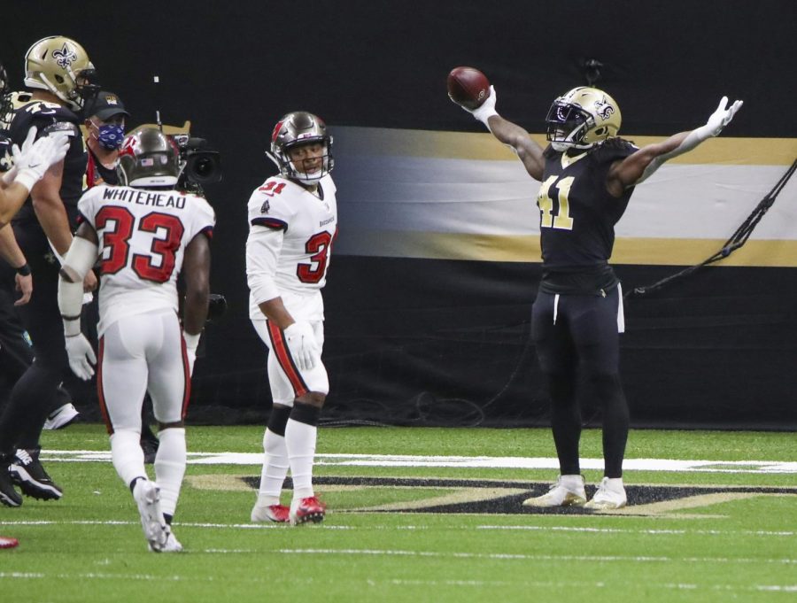 New Orleans Saints running back Alvin Kamara (41, right) celebrates his second touchdown of the game as Tampa Bay Buccaneers safety Antoine Winfield Jr. (31) turns away during the second quarter on Sunday, Sept. 13, in New Orleans, La.