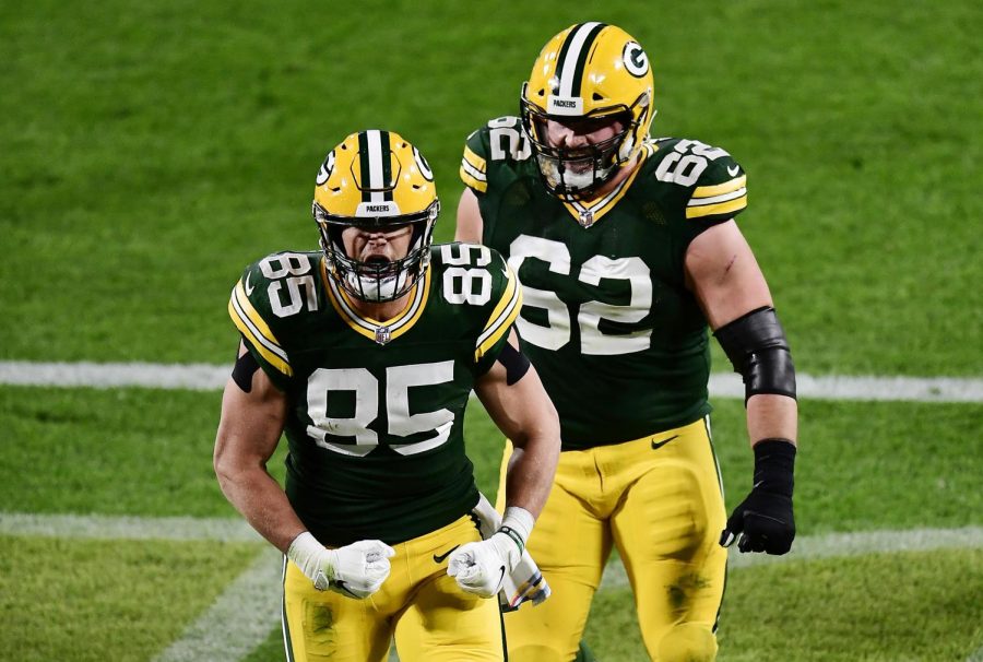 The Green Bay Packers' Robert Tonyan (85) celebrates with Lucas Patrick (62) after scoring a touchdown against the Atlanta Falcons at Lambeau Field in Green Bay, Wis. on Oct. 5.