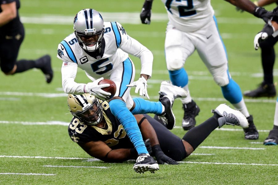 Carolina Panthers quarterback Teddy Bridgewater (5) runs with the ball while being tackled by the New Orleans Saints David Onyemata (93) in the first quarter at the Mercedes-Benz Superdome in New Orleans on Sunday, Oct. 25, 2020.