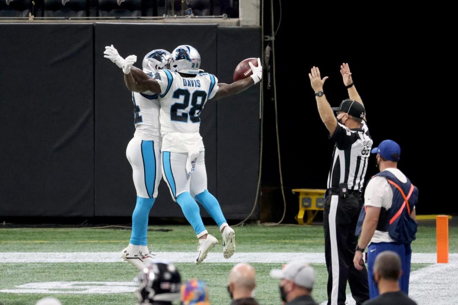 Carolina Panthers running back Mike Davis (28) celebrates his receiving touchdown with wide receiver Pharoh Cooper (14) in the second quarter against the Atlanta Falcons on Sunday, Oct. 11, at Mercedes-Benz Stadium in Atlanta, Georgia.