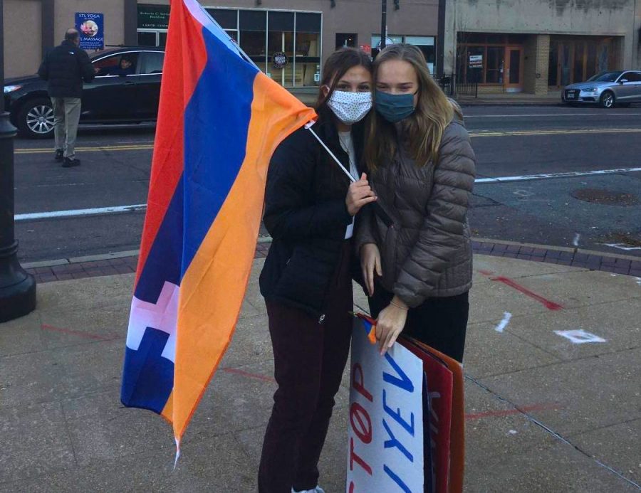 Holding the Armenian flag and signs at a protest, juniors Mira Nalbandian and Anna Newberry work to bring awareness to the Armenia-Azerbaijan conflict. As an Armenian, Nalbandian feels that it is important for individuals to recognize and be aware of global issues. “The American media hasnt really done a good job of bringing light to any of these issues and thats very harmful. People have the power to make change by organizing, but when were not aware of whats going on, its even harder to resolve these issues,” Nalbandian said. “This is hard for many Armenians because we just want recognition and help.”