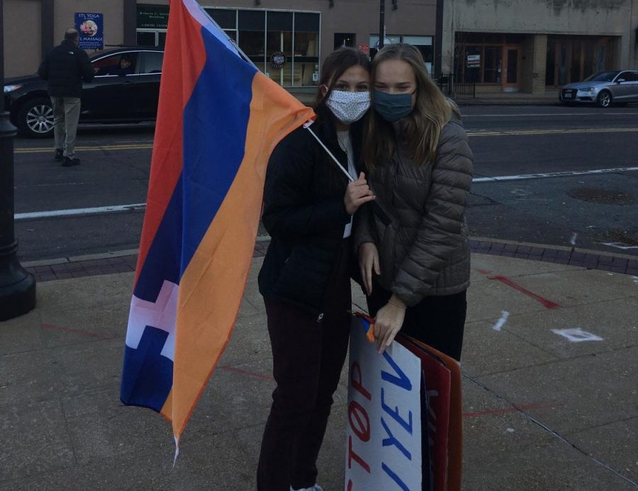 Holding the Armenian flag and signs at a protest, junior Mira Nalbandian and Anna Newberry work to bring awareness to the Armenia-Azerbaijan conflict. As an Armenian, Nalbandian feels that it is important for individuals to recognize and be aware of global issues. “The American media hasnt really done a good job of bringing light to any of these issues and thats very harmful. People have the power to make change by organizing, but when were not aware of whats going on, its even harder to resolve these issues,” Nalbandian said. “This is hard for many Armenians because we just want recognition and help.”