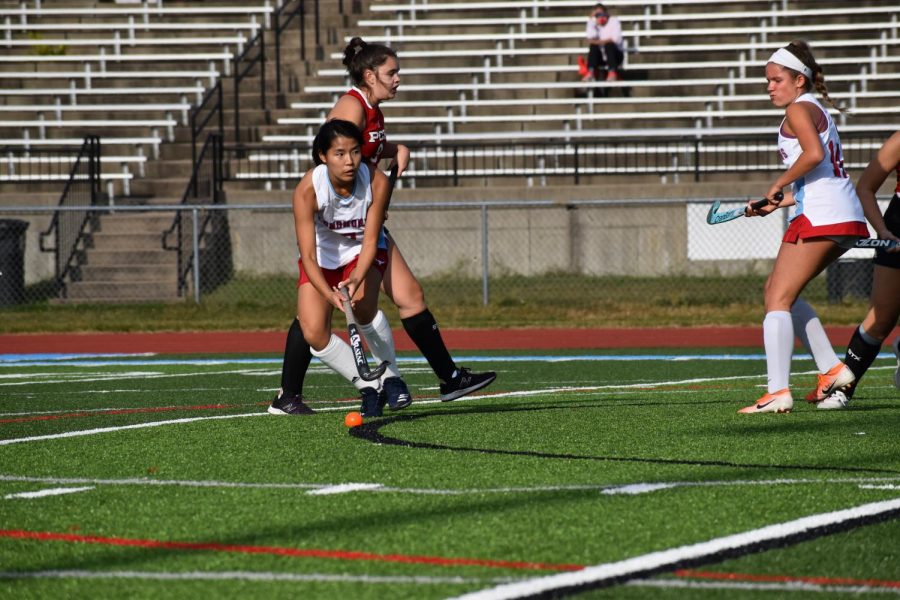 Playing center midfield, junior Marissa Liu pushes the ball upfield. To stay focused, Liu worked on her skills and always found ways to improve. “My favorite strategy was transferring the ball,” Liu said. “I moved the ball to the other side of the field to open up space.”