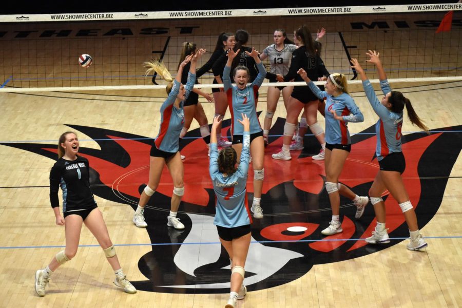 The girls varsity volleyball team come together celebrating a block by senior Maddy Truka (2). The team finished with a record of 12-5 alongside a second place finish at the state tournament. “It still feels surreal, but I couldn’t think of a better way to have ended my senior season,” senior and team captain Carly Kuehl said. “I think going into the season not thinking we would have a season makes it even better. At the beginning, we weren’t really working for an end goal. As we kept moving on and kept winning, my excitement and desire to keep winning grew. I’m just so proud of my team and happy that this is how I got to end my volleyball career.”