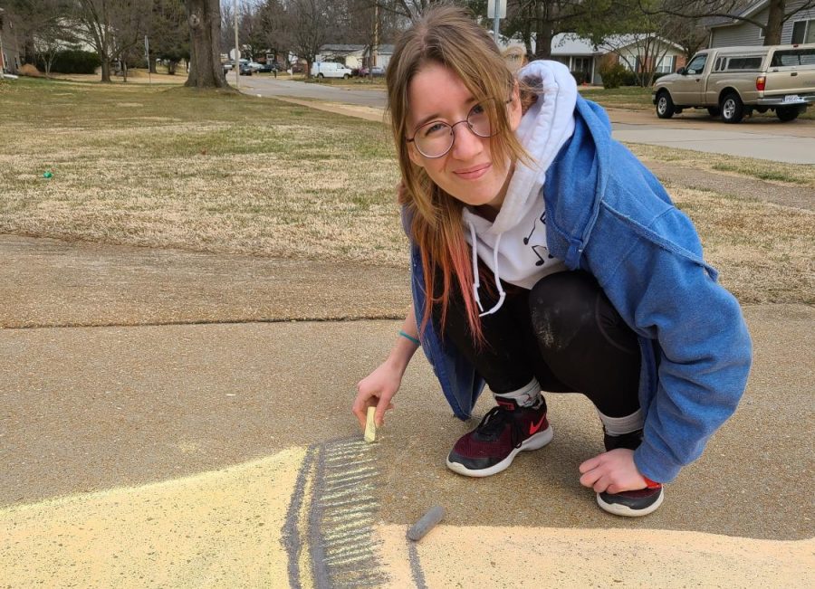 Junior Anna Knott finishes up the drawing of the leg lamp from the 1983 movie, “A Christmas Story.” Knott and her mom worked together to be able to create fun and relatable drawings. “A lot of people were commenting on our art and often had suggestions which made it so much more fun,” Knott said. 