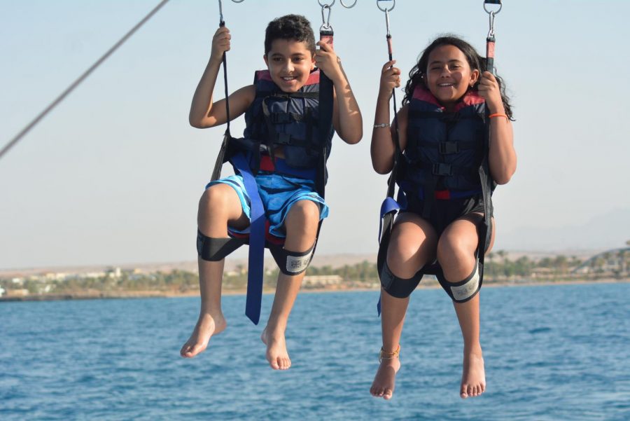 On a trip to Hurghada, Egypt, freshman Alia Hammad and her cousin Omar parachute over the Red Sea. This adventure took place in July 2019, about four months before her big move. I loved it. I saw the purple jellyfish and coral [because] the water was so clear.” Hammad said. 