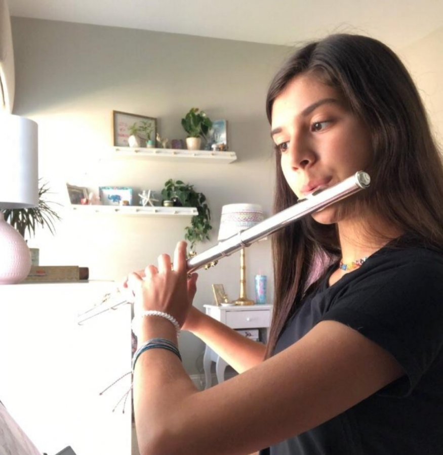 Practicing after school, freshman Alexandra DeLuca performs her scales. DeLuca practices daily to build her playing skills. “When I played a piece that I really liked it really relaxed me. It gives me a sense of pride afterward,” DeLuca said. 