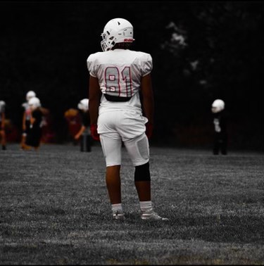 Awaiting the next play, senior Jailyn Jones anticipates the ball coming to him. Jones had two fumble recoveries this season and was ranked by STLHighSchoolSports.com. “Sometimes you have those moments on the field where you just need to breathe,” Jones said.