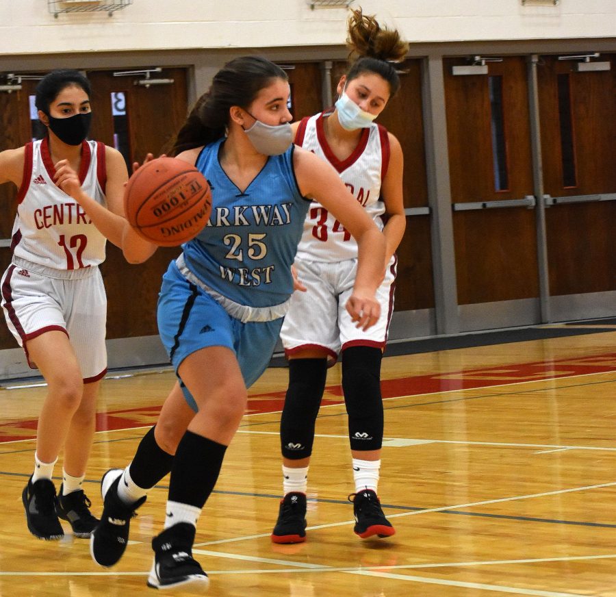 Dribbling the ball down the court, sophomore Maddie Humme looks for an open teammate to make a play. Humme has played basketball since she was in 1st grade and she is now in her junior varsity basketball season. “Basketball is my zen. Ive always made time for it. When I am on the court, I am solely focused on basketball,” Humme said. “I love being a part of a team and contributing all I have to give.”