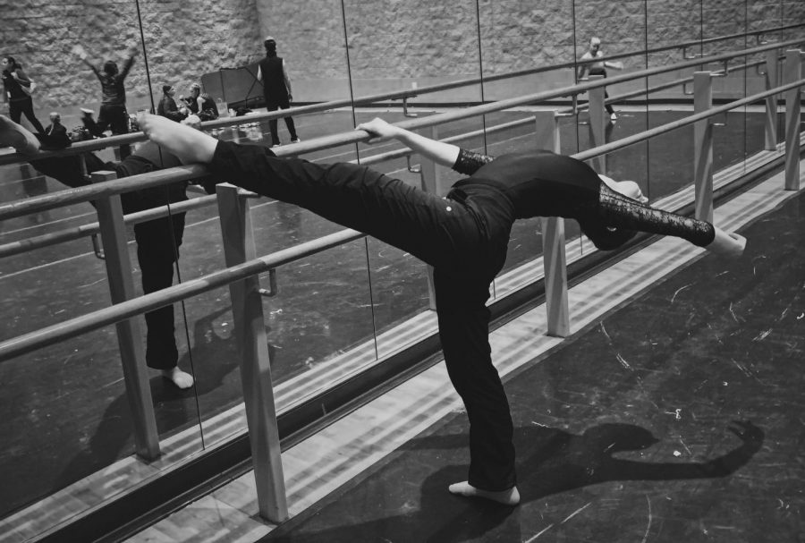 Sophomore Olivia Davis practices her flexibility, form and balance at the barre.