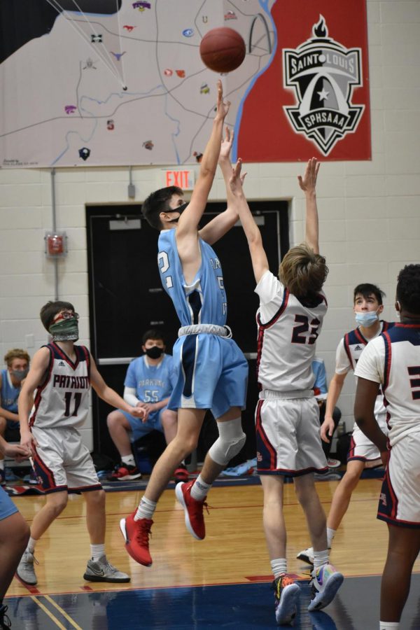 Freshman center Chase Haun goes up for a basket to take the lead against Parkway South. In mid-December, the freshmen boys basketball team defeated the Patriots 36-35. “Going up with the ball there was very risky because of the percentage of that shot. It was a mid-ranger that was semi-contested and I’m surprised that I made it,” Haun said.