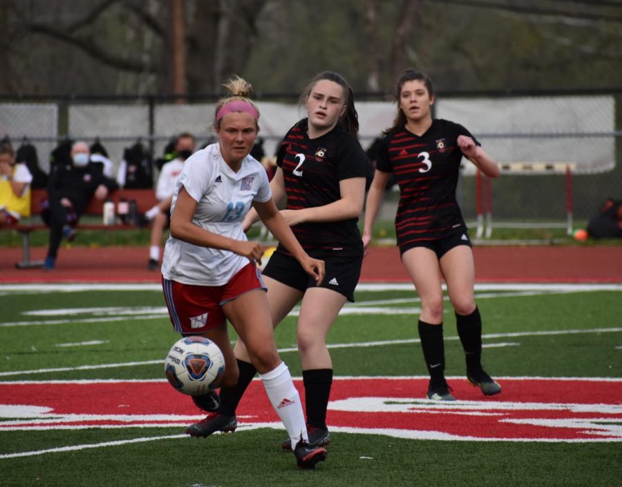 Carrying the ball forward, left defender and junior Ella Mercer dribbles away from Parkway Central seniors Kaylee Canoy and Brooke Taeckens. Mercer has played soccer since she was five years old and is a three-year member of the varsity team. “Soccer has always been a huge part of my life. I love using it as a way to de-stress and get exercise. No matter what I have going on outside of soccer, as soon as I’m on the field it disappears and I forget about it for an hour and a half,” Mercer said. “Soccer is both a mental and physical sport, you always have to be thinking about the next play, and where you need to be and where the next ball needs to go. I love getting to incorporate both the mental and physical aspect on the field.”
