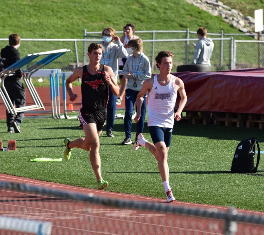 Senior Thomas Andersen competes against his friend, senior Andrew Ahrens from Parkway Central High School, in varsity track meets. Andersen met some friends in club track over the summer who he now has friendly competitions with. “Its really just us battling it out at those meets, but its really fun and theres no bad blood between us. We always talk trash before and after races, but its all friendly rivalries,” Andersen said. 