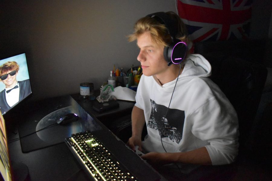 Turning on his PC and putting on his headphones, sophomore Nick Malchanav prepares to play Fortnite. Malchanav received a spot in the top 5 during a 128-person tournament hosted by rematch.gg. “I love to get kills, and I always challenge myself and how many kills I can get in a match. I don’t really go for the win. It was basically what I played the game for,” Malchanav said.