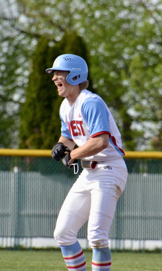 Celebrating after he hit a double, senior Nick Harms laughs with his friends and teammates on the varsity baseball team. In a game against Francis Howell Central High School April 5, the team won 18-13, and also ranked as No. 1 in the state Class Five power rankings from the Missouri High School Baseball Coaches Association. “We have hit the season in stride despite the cancellation of last years season because many of us play for summer teams [and] were able to get in seasons last summer,” Harms said. “I’m making sure I soak in all the moments like celebrating teammates’ successes and having fun at practices.”