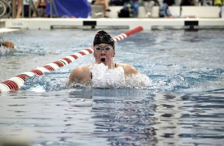 Senior Reese Berry performs a breaststroke at the Kirkwood Quad. At the meet, she placed first in the 100-meter breaststroke. “I was very excited to swim in this specific meet because we were going against hard competition, but going this hard at these meets will end up to my injury.”