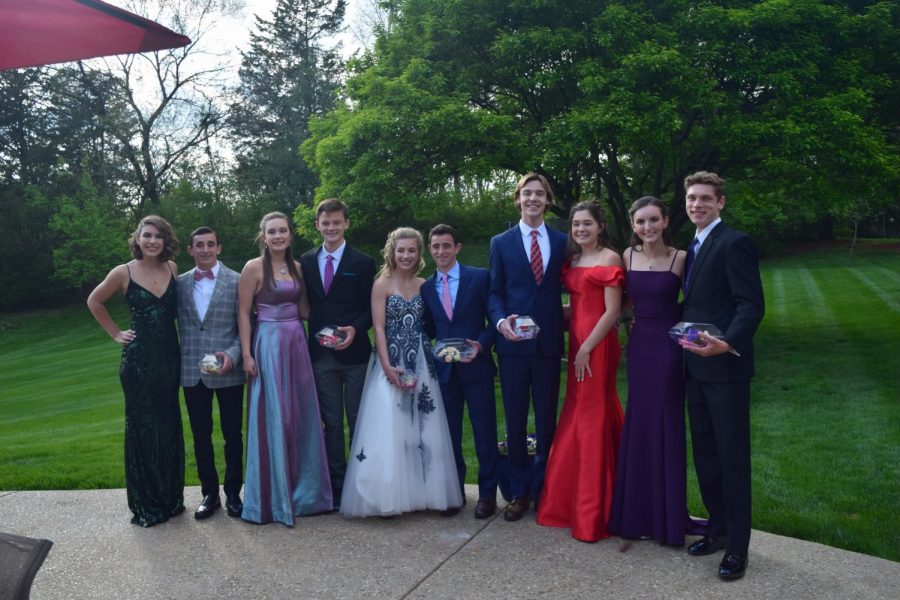 Posing with their prom dates, senior Luke Lung and his friends celebrate planning their own prom. The group dined, danced and sung during the night. “My favorite moment of the night probably had to have been when we did karaoke. Everyone in the group has amazing voices and we had a blast singing and just enjoying the night,” Lung said. 