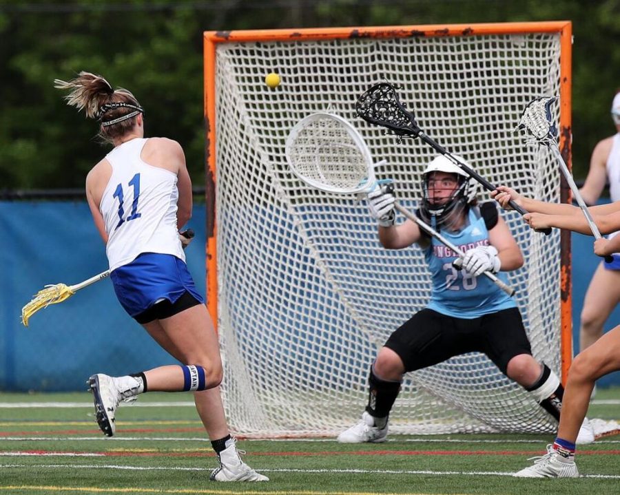 Freshman and goalie Rachel Livak reaches out to save the ball from going in the net and prevents  a point for Ladue. Livak made the varsity team and has led the St. Louis area in saves with 213. “The most memorable part of my season was when they were telling us what teams were going to be on, I honestly kind of knew when I was told to go talk to Lovercheck and Herpel, but it was still an amazing feeling to know that I did it,” Livak said. 
