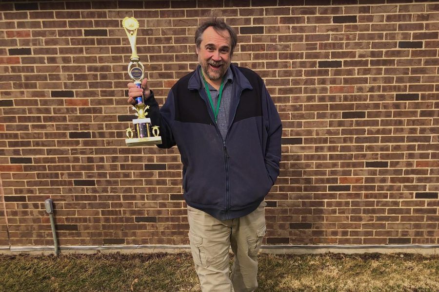 Special Education assistant Jeff Taylor shows off his first-place trophy from the 2016 Pyromania fireworks competition. In this nationwide contest known as SkyWars, Taylor arranged fireworks from a provided selection and designed a visual display in four hours. “There was a lot going on. I wasn’t crazy about it during the moment, but the more I did it, the more interested I got in fireworks,” Taylor said.
